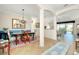 Dining area with elegant furnishings, columns, and view of the living room at 20460 Granlago Dr, Venice, FL 34293