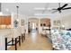 Open-concept living area with tile flooring and views into the kitchen and foyer at 20460 Granlago Dr, Venice, FL 34293