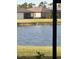 Tranquil lake view with birds and neighborhood homes in the background at 2145 Bonito Way, Port Charlotte, FL 33953