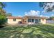 Backyard with patio and large tree at 225 Firenze W Ave, Venice, FL 34285