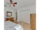 Bedroom with large closet and ceiling fan at 225 Firenze W Ave, Venice, FL 34285