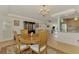 Open dining room with view of kitchen and living room at 225 Firenze W Ave, Venice, FL 34285