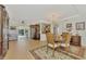 Spacious dining area with wood table and chandelier at 225 Firenze W Ave, Venice, FL 34285