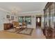 Dining room features a round table and hardwood floors at 225 Firenze W Ave, Venice, FL 34285