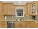 Bright kitchen, granite countertops, stainless steel appliances, and ample wood cabinets at 225 Firenze W Ave, Venice, FL 34285