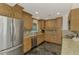Spacious kitchen with granite countertops and wood cabinets at 225 Firenze W Ave, Venice, FL 34285