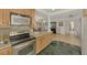 Kitchen with stainless steel appliances and granite countertops at 225 Firenze W Ave, Venice, FL 34285