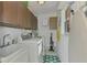 Laundry room with washer, dryer, and cabinets at 225 Firenze W Ave, Venice, FL 34285
