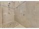 Walk-in shower with tiled walls and mosaic floor at 225 Firenze W Ave, Venice, FL 34285