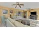Sunroom with comfortable seating and a fireplace at 225 Firenze W Ave, Venice, FL 34285