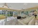 Sunroom with tiled floor and plenty of natural light at 225 Firenze W Ave, Venice, FL 34285