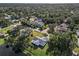 Aerial view of a house near the water, surrounded by trees at 2281 Mars Rd, Venice, FL 34293
