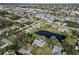 Aerial showing home's location in a residential neighborhood near pond at 2281 Mars Rd, Venice, FL 34293