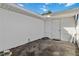 Small backyard with concrete patio and white fence at 2281 Mars Rd, Venice, FL 34293