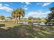 Large backyard with pond and lush landscaping at 2281 Mars Rd, Venice, FL 34293