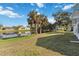 Large backyard with pond and lush landscaping at 2281 Mars Rd, Venice, FL 34293