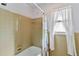 Bathroom with shower/tub combo and tile walls at 2281 Mars Rd, Venice, FL 34293