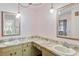 Double vanity with large mirrors in this bathroom at 2281 Mars Rd, Venice, FL 34293