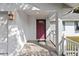 Inviting front porch with a charming burgundy door at 2281 Mars Rd, Venice, FL 34293