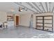 Garage with washer, dryer, and ample storage shelving at 2281 Mars Rd, Venice, FL 34293