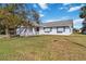 Single story home with a red door and white picket fence at 2281 Mars Rd, Venice, FL 34293