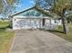 House exterior with driveway and landscaping at 2281 Mars Rd, Venice, FL 34293