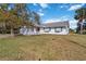 Single story home with a red door and white picket fence at 2281 Mars Rd, Venice, FL 34293