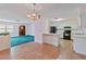 Bright kitchen with white cabinets, black appliances, and tile floors at 2281 Mars Rd, Venice, FL 34293