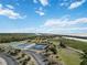 Aerial view of tennis courts and basketball court by the water at 2281 Mars Rd, Venice, FL 34293