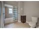 Clean bathroom featuring a shower/tub combo and tiled floors at 23102 Madelyn Ave, Port Charlotte, FL 33954