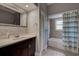 Bathroom with a vanity, tiled shower and tub at 23102 Madelyn Ave, Port Charlotte, FL 33954