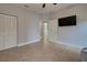 Simple bedroom with tile floors and a closet at 23102 Madelyn Ave, Port Charlotte, FL 33954