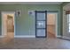 Bedroom with a barn door leading to the bathroom and closet at 23102 Madelyn Ave, Port Charlotte, FL 33954