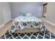 Bedroom with a queen-size bed and patterned rug at 23102 Madelyn Ave, Port Charlotte, FL 33954
