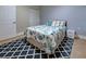 Bedroom with a queen-size bed and patterned rug at 23102 Madelyn Ave, Port Charlotte, FL 33954