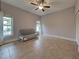 Spacious bedroom with tiled floors and a sofa at 23102 Madelyn Ave, Port Charlotte, FL 33954