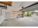 Garage with storage shelving and opener at 23102 Madelyn Ave, Port Charlotte, FL 33954
