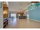 Open concept kitchen with granite island and stainless steel appliances at 23102 Madelyn Ave, Port Charlotte, FL 33954