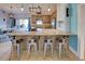 Kitchen with granite countertop island and wooden cabinets at 23102 Madelyn Ave, Port Charlotte, FL 33954