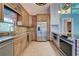 Updated kitchen featuring stainless steel appliances and an island at 23102 Madelyn Ave, Port Charlotte, FL 33954