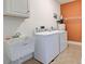 Laundry room with washer, dryer, and utility sink at 23102 Madelyn Ave, Port Charlotte, FL 33954