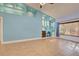 Living room with built-in shelving and light blue accent wall at 23102 Madelyn Ave, Port Charlotte, FL 33954