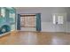 Living room with built-in shelving and large window at 23102 Madelyn Ave, Port Charlotte, FL 33954