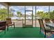 Covered patio with seating area and view of the backyard at 23102 Madelyn Ave, Port Charlotte, FL 33954