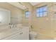 Clean bathroom, featuring a white vanity, bathtub, and shower at 2331 Harrier Way, Nokomis, FL 34275