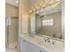 Double vanity bathroom with updated fixtures and a shower at 2331 Harrier Way, Nokomis, FL 34275