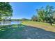 Picturesque golf course scene with a pond and walking path at 2331 Harrier Way, Nokomis, FL 34275