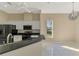 Modern kitchen features stainless steel appliances and granite countertops at 2331 Harrier Way, Nokomis, FL 34275