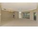 Bright and airy living room with access to sunroom at 2331 Harrier Way, Nokomis, FL 34275