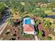 Community pool and clubhouse, surrounded by landscaping at 2331 Harrier Way, Nokomis, FL 34275